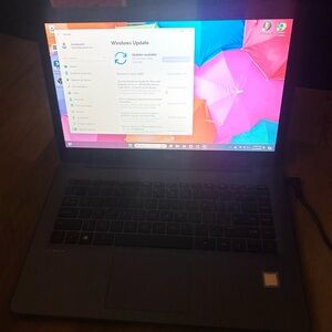 HP Laptop with Black Chassis and Colorful Display